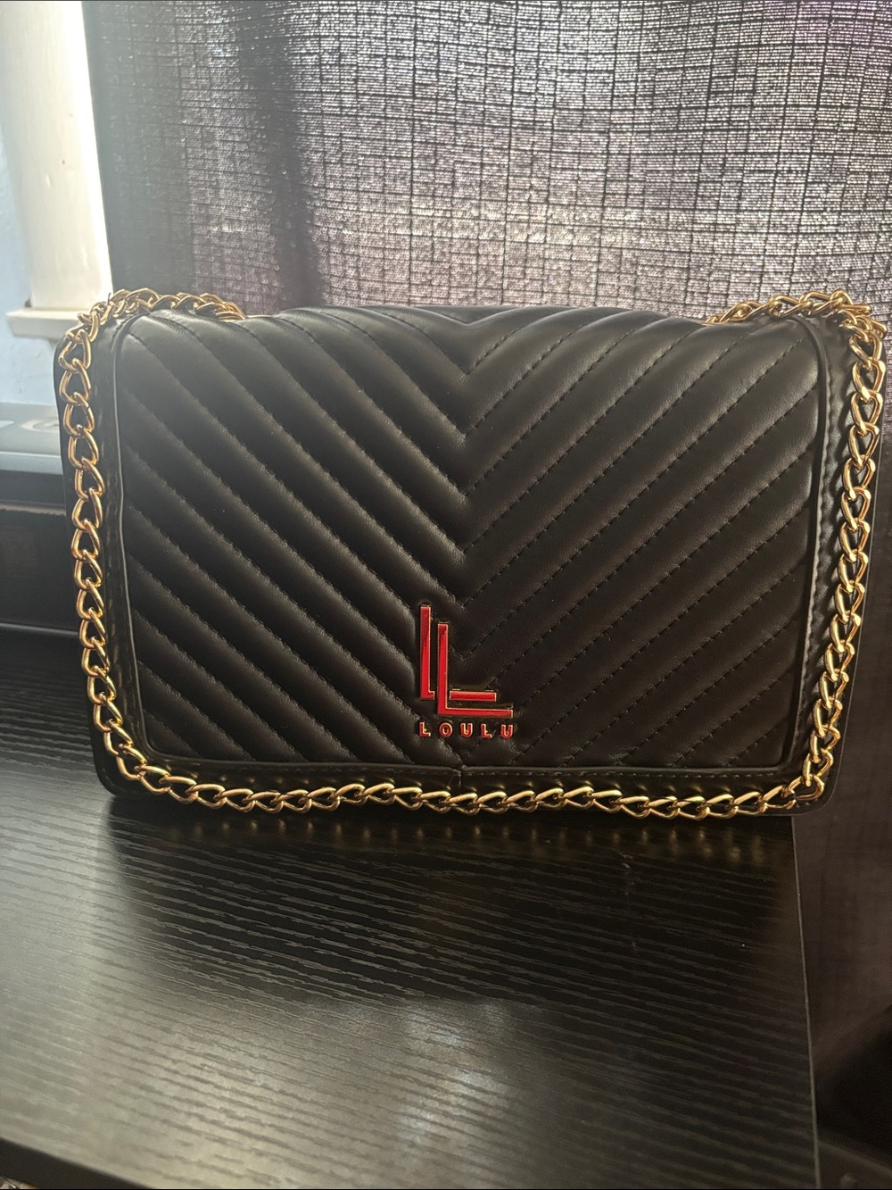 Loulu  Black Quilted Crossbody with Gold Chain and Red Logo